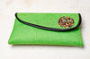 green clutch bag